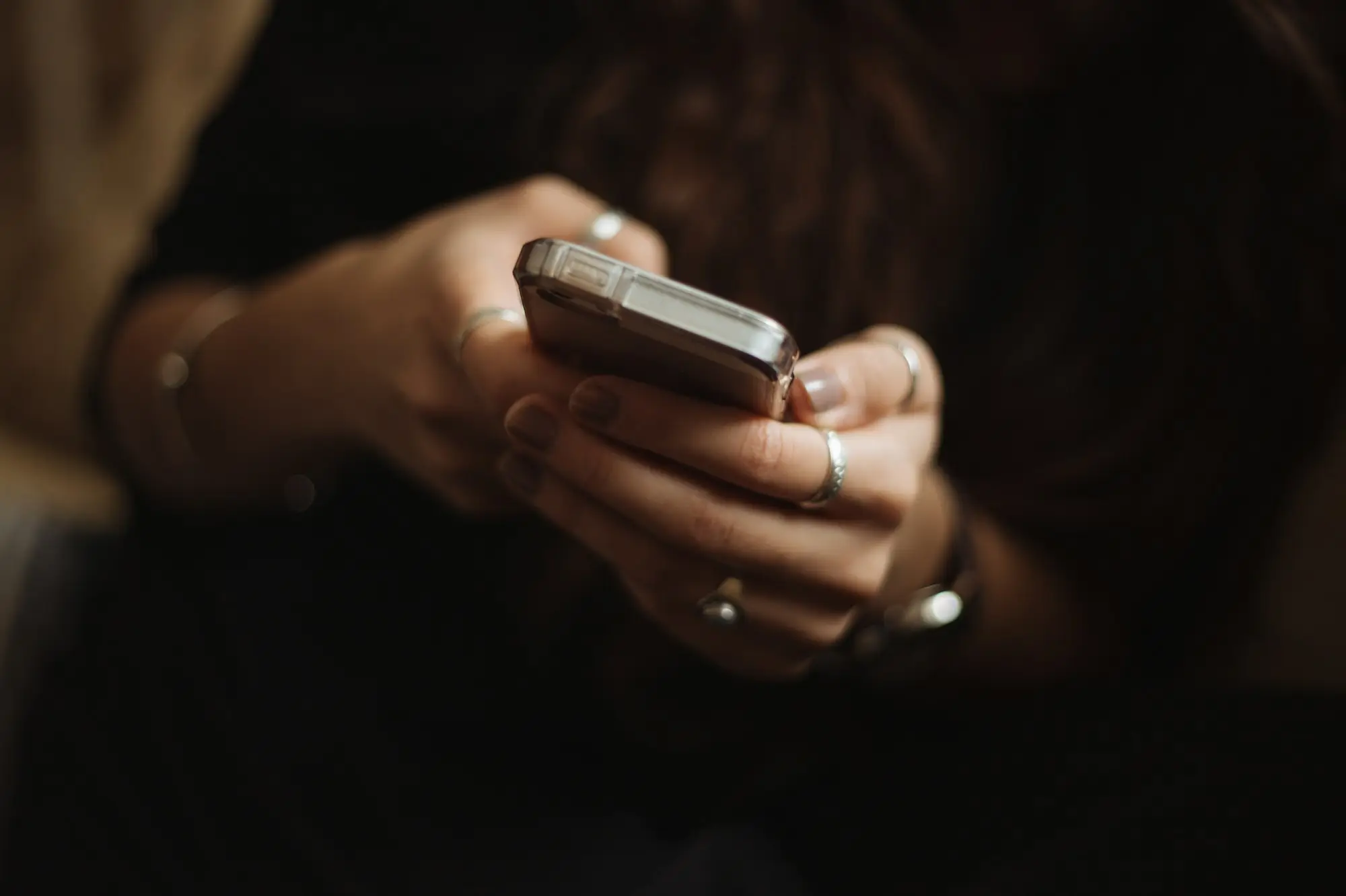 Business owner looking at an incoming call on a phone