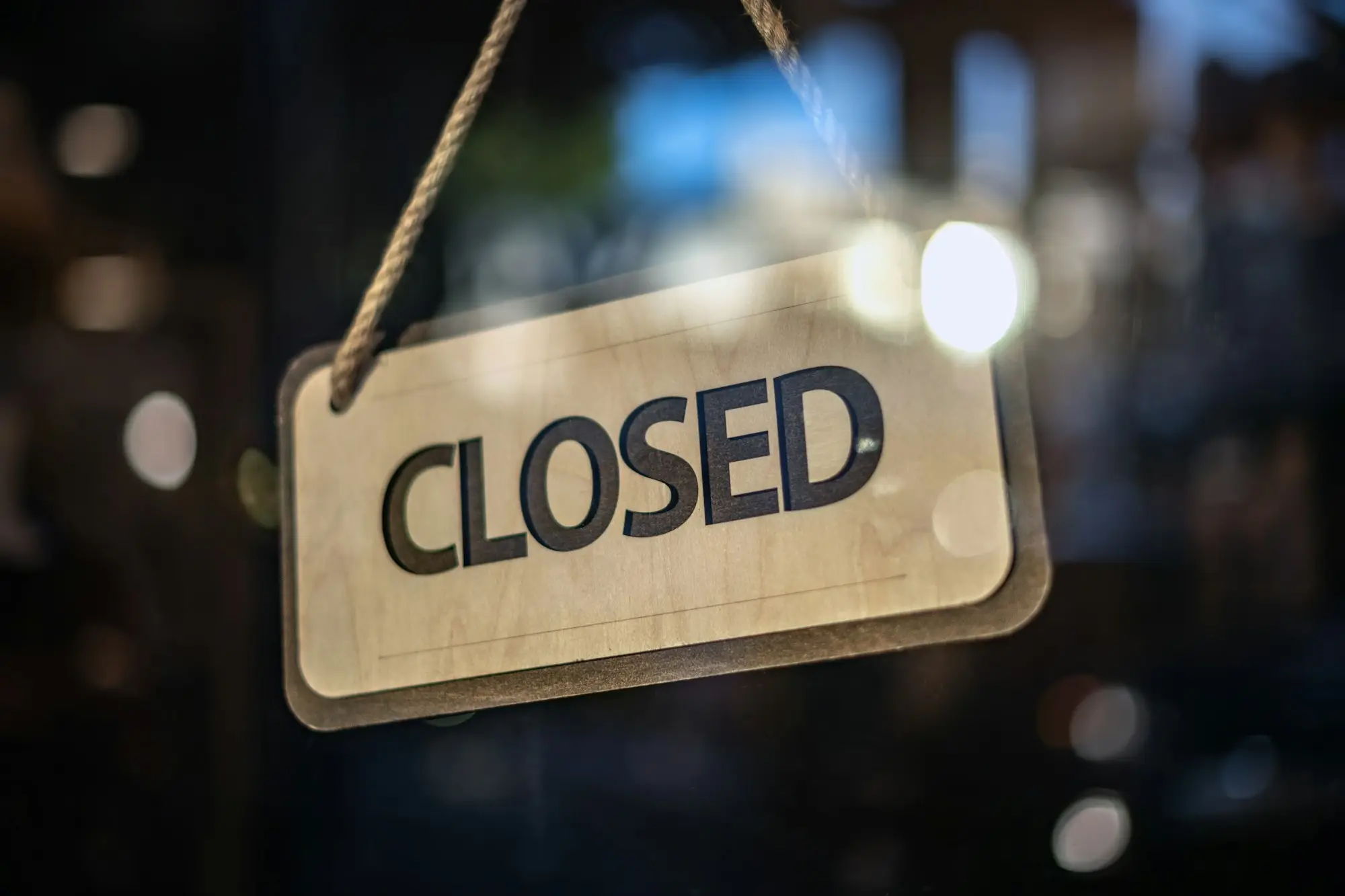 Closed sign hanging on a shop door