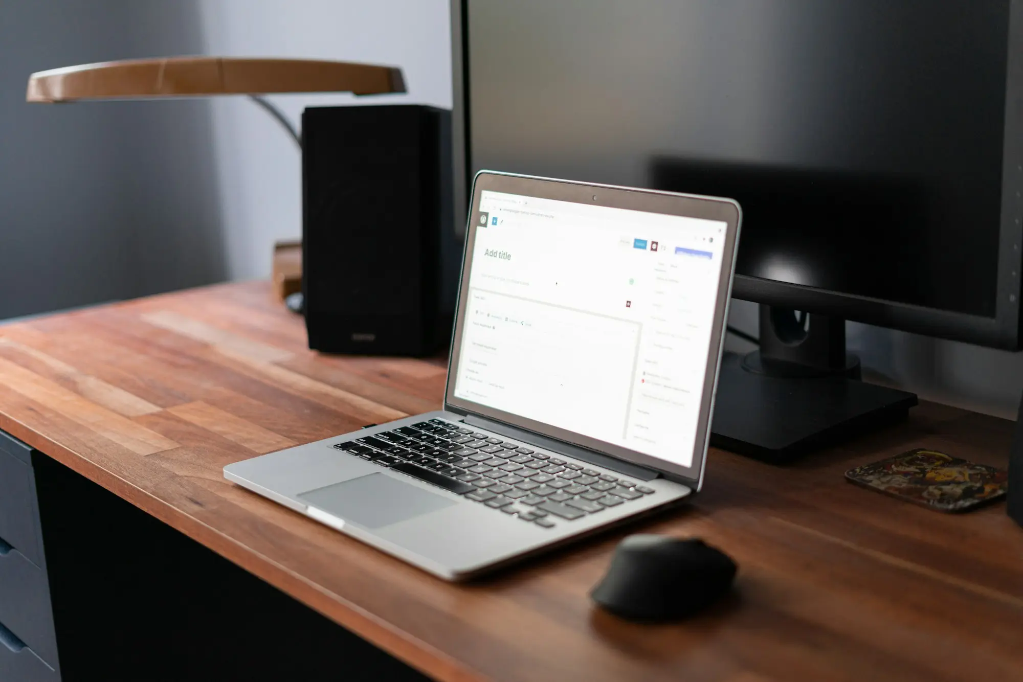 Laptop open on a desk for month-end invoicing